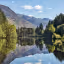 The image is a stunning, high-quality landscape photograph. It is exceptionally well-composed with a striking reflection, perfectly lit with natural light, and sharp throughout. The colors are accurate and vibrant, contributing to its strong photo-realism. All essential elements are in sharp focus.
